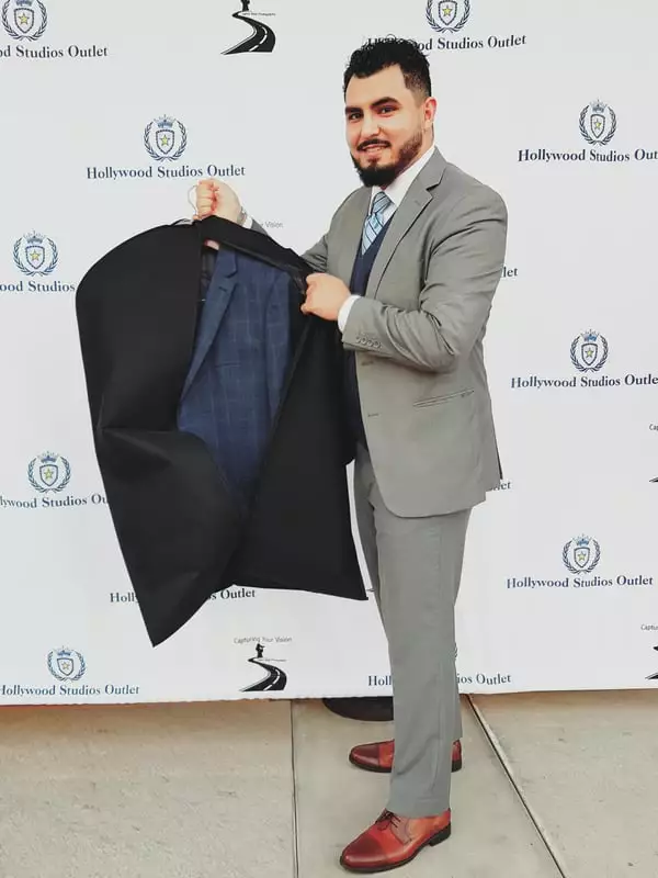 Happy customer with new suit from Outlet